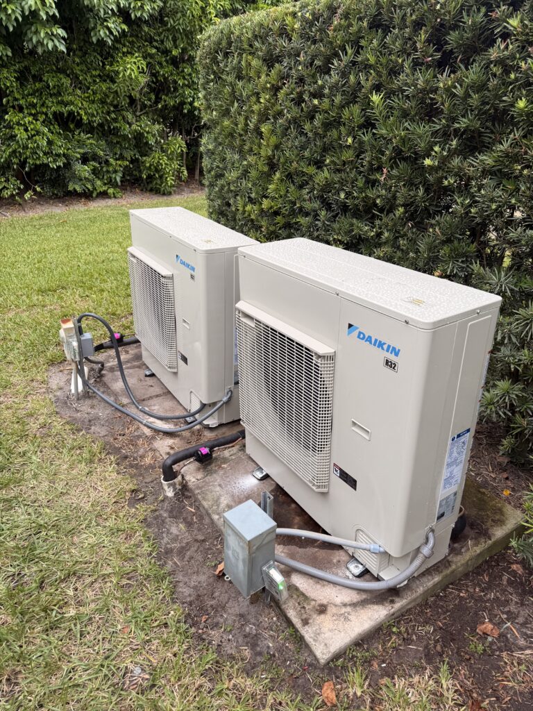 Two Daikin outdoor units installed at a home in Royal Palm Beach, Florida by Swift Air Conditioning
